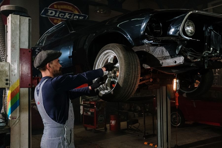 Mechanic servicing a car wheel